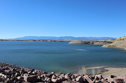 Aerial view of Lake Pueblo showing the blue water and blue sky near Happy Acres RV Park in Pueblo, Colorado.